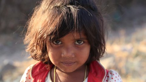 MANDU, INDIA - FEBRUARY 03, 2017 : An unidentified Indian poor child on the street . Poverty is a major issue in India