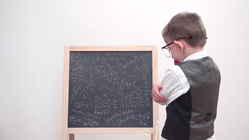 Funny child focus on chalk board with math scribble, exhausted student with eyeglasses and uniform, heavy learning Royalty-Free Stock Footage #29112286