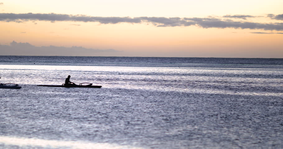 Canoe on a lagoon with sunset, tahiti polynesia