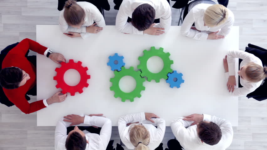 Business problem solution, mechanism of business, teamwork concept, business team sitting around white table with cogs Royalty-Free Stock Footage #29115703