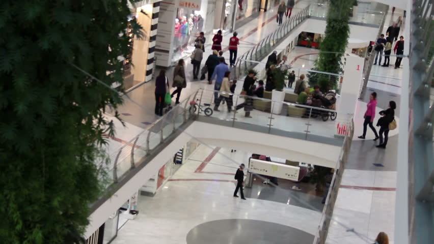walking crowd inside of shopping mall (unrecognizable people)