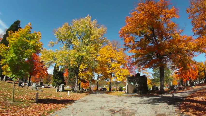 Tracking shot of a cemetery on a crisp Autumn day in Western Pennsylvania.