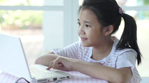 Close up of cute asian children using laptop slow motion