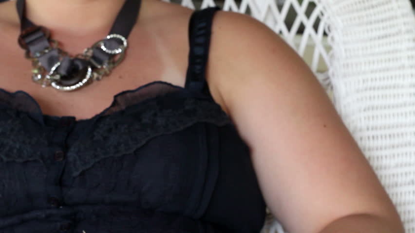 Woman prepares to use shock collar on dog - Angle 1