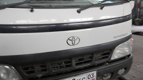 ULAN-UDE, RUSSIA - CIRCA MARCH 2013: A closeup view at Toyota logo on a Toyota ToyoAce truck. Toyota is the best selling brand of vehicles in the eastern Russia.