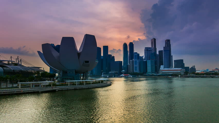 SINGAPORE - 12 OCTOBER 2012: Timelapse view of Singapore skyline at sunset from