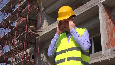 Tired stressed overwhelmed foreman workman headache builder in pain at workplace