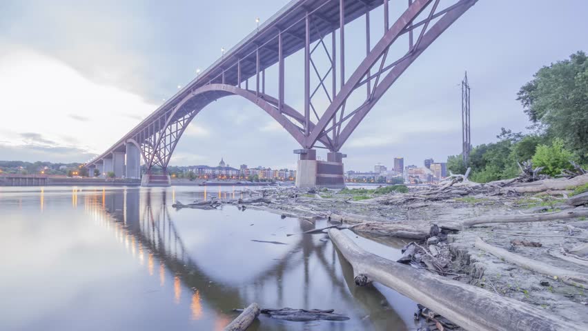 A Wide Angle Shot of the Smith Ave High Bridge Spanning the Mighty Mississippi River and St Paul Cityscape During Twilight 4K UHD Timelapse