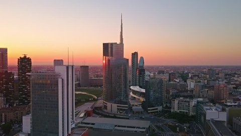 Milan, JAN 05, 2017:city of milan  aerial view at sunrise flying over city