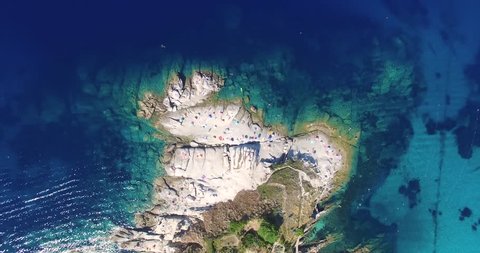Aerial flight circulating around a Mediterranean peninsula in Italy 