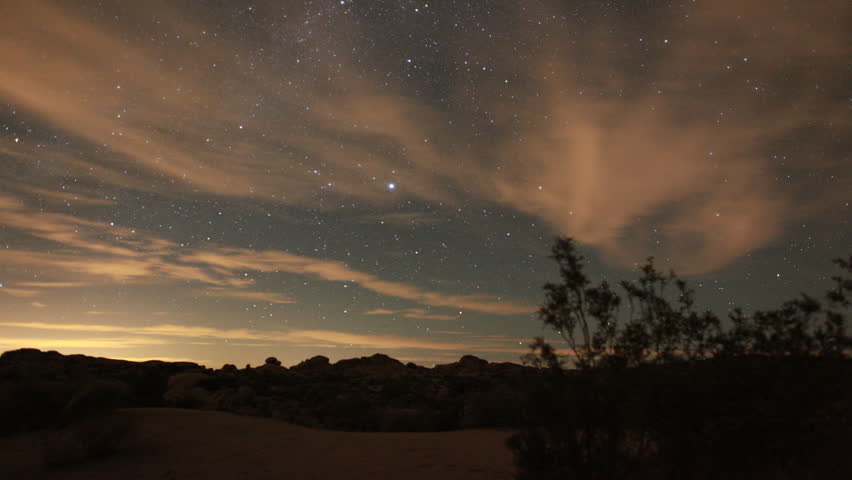 Incredible Night Sky Stars Passing Over Joshua Tree in long exposure timelapse.