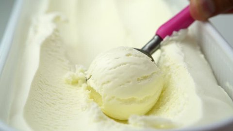 Close up of vanilla ice cream being scooped. (4K, HD, high definition 1080p).