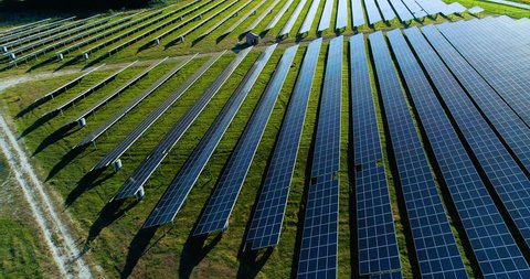 Solar panel farm seen from above, filmed by drone in france