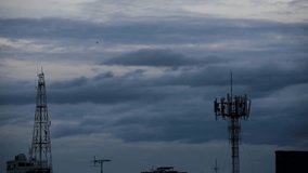 Silhouette Telecommunication Tower, Satellite Dish, Mobile Phone and Television Antennas with Slowly Movement of Peaceful Cloudy Sky Background 1080p HD Video, Footage Clip