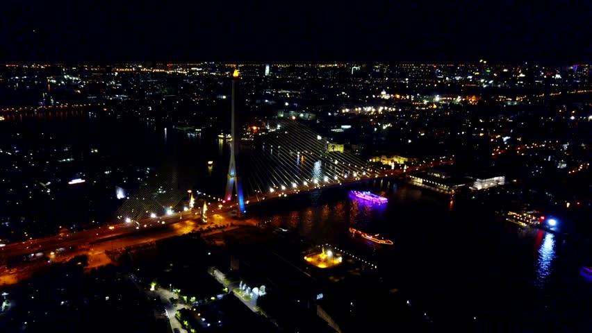  Bangkok,Thailand, aerial night view from the drone  on the bridge Rama VIII, at Chao Phraya river