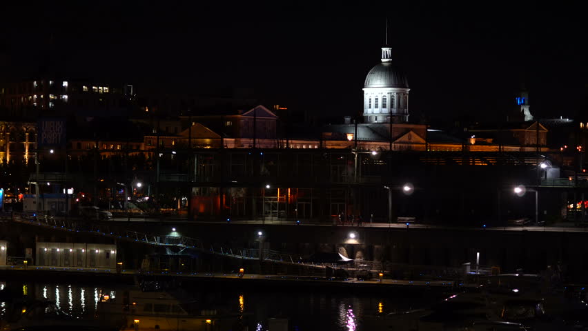 MONTREAL, CANADA - JULY 2017: Cinematic night footage of the summer scenery in the old port of Montreal downtown