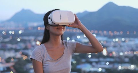 Woman looking though VR device 
