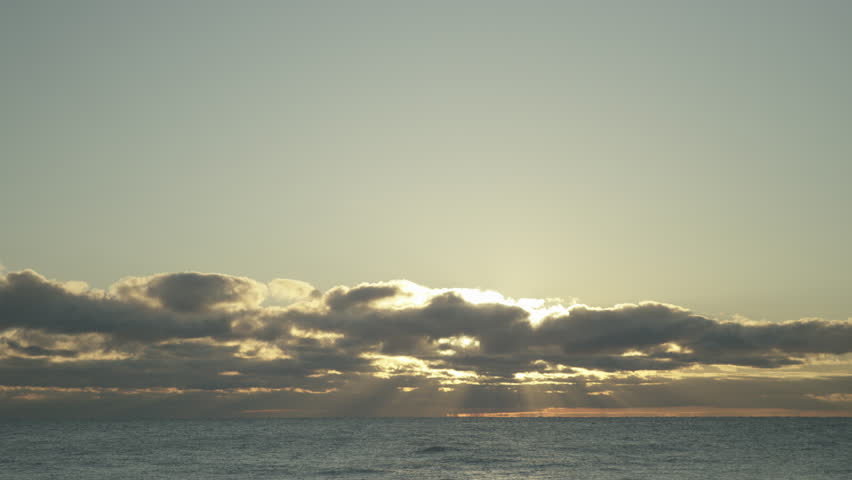 Sun shining through clouds above Lake Michigan 1