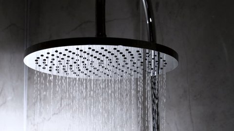 Shower flowing in close-up and slow motion