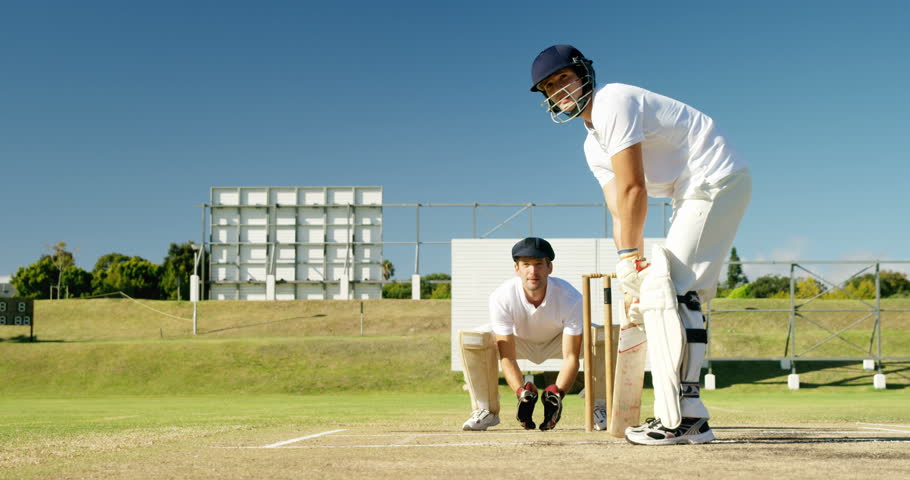 Batsman hitting a ball during match on cricket field Royalty-Free Stock Footage #29210122