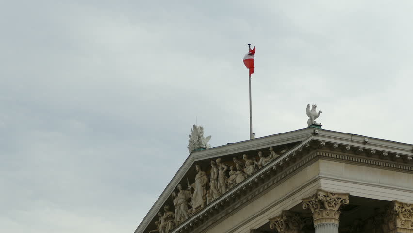 Austrian flag on top of Parlament building Vienna