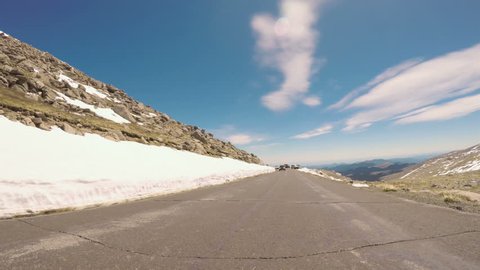 Denver, Colorado, USA-June 10, 2017.  POV point of view -  Driving on alpine road of Mount Evans in Early Summer.