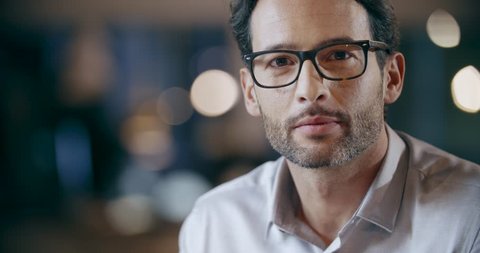 Confident man with eye glasses smiling portrait. Corporate business team work office meeting. Caucasian businessman and businesswoman people group talking together. Collaboration, growing, success. 4k video