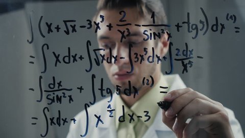 scientist wrote mathematical formulas on a blackboard