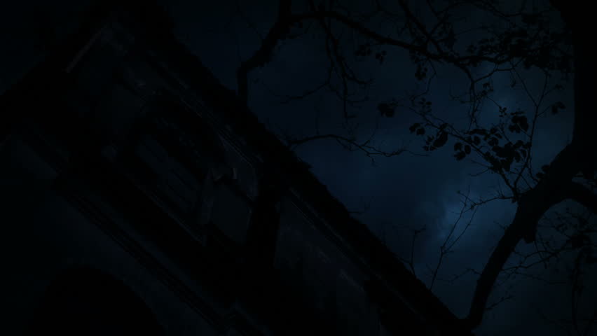 Zombie hand rising out from old grunge castle over dead tree, moon and cloudy sky, Spooky background, Halloween concept
