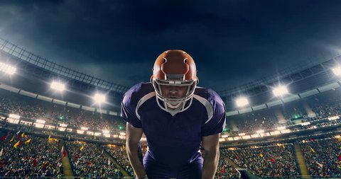 4K footage of an American football player is cheering on a professional sports stadium. He wears unbranded clothes. The stadium is made in 3D.
