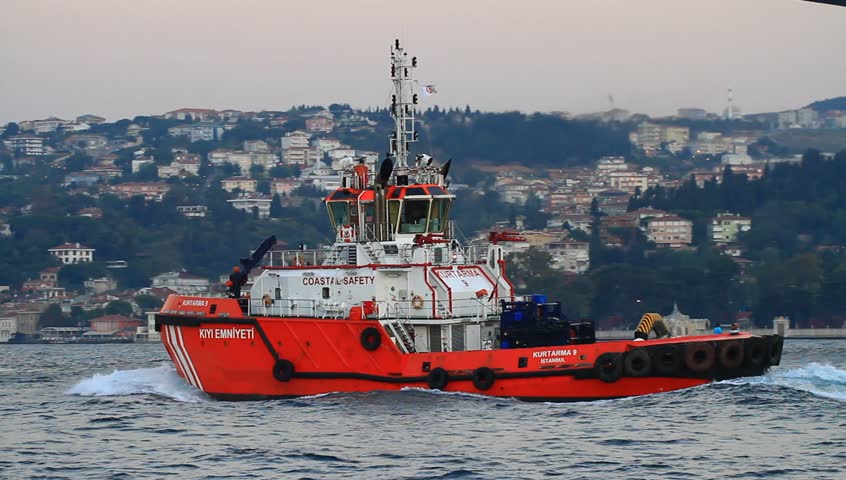 ISTANBUL - OCT 7: Escort and ship handling tugboat KILAVUZ 9 sails into Bosporus