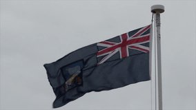 Falkland Island flag flies in a stiff breeze in Port Stanley