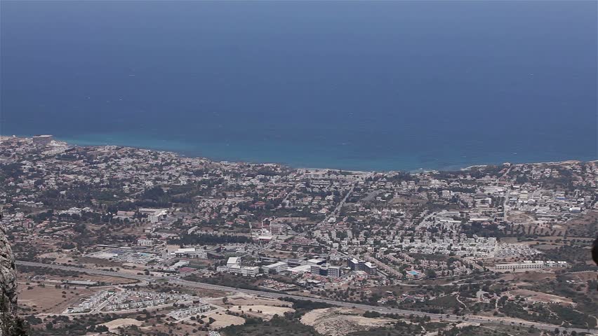 Top view of a big city by the sea, Panorama of the city near the sea, view from above, far away, at a distance,  from air