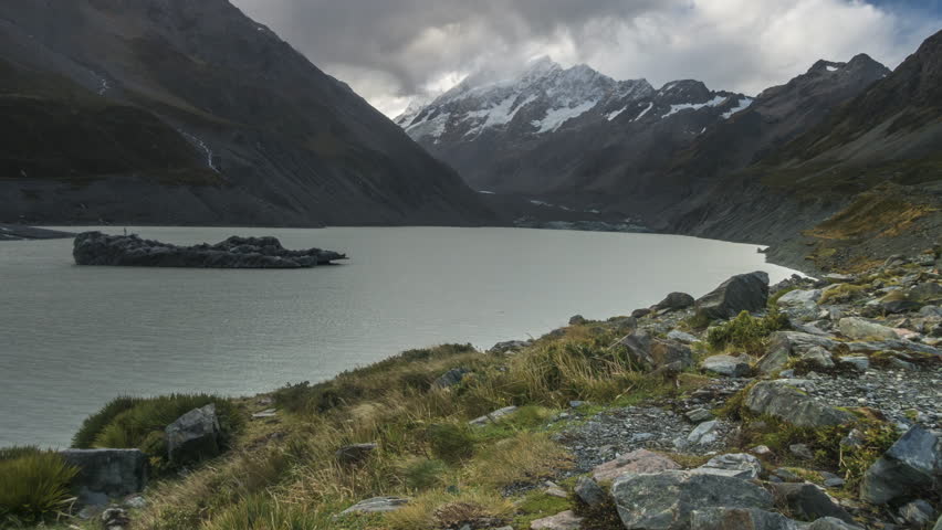 Time Lapse - Clouds moving at Mount Cook with Hooker Lake as foreground. Captured during rain, water droplets on lens. Camera pan top