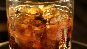 High quality video of cold drink with ice cubes in 4K

