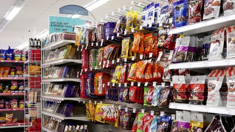 Coquitlam, BC, Canada - July 26, 2017 : Motion of display chocolate and candy corridor in shopper drug mart store with 4k resolution