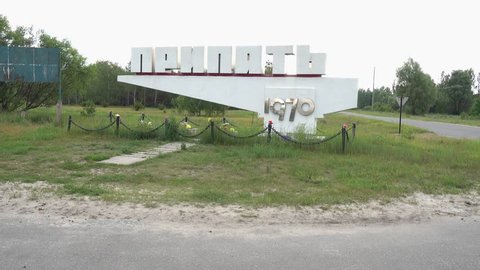 Pripyat, Chernobyl, Ukraine - 17th of June 2017: Visit to Pripyat Ghost Town - 4K Zoom in Pripyat city sign
