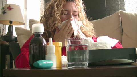 Sick women sneezing