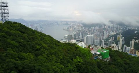Fly over nature on mountain to IFC tower, sky100 Tower Hong Kong City, Hongkong, Hong Kong 4k video aerial