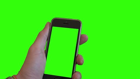 緑の画面に電話を表示しています 緑の画面の背景に緑のスマートフォンを持つ手 の動画素材 ロイヤリティフリー Shutterstock