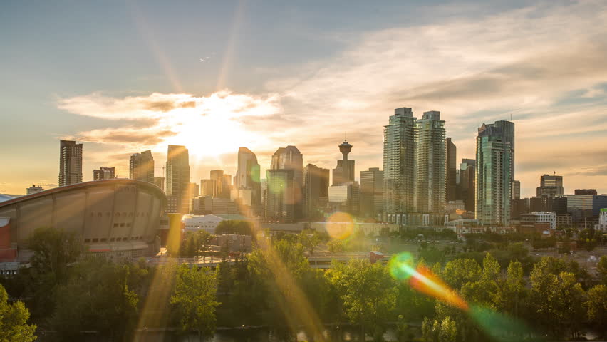 Beautiful Calgary Sunset Time Lapse of Skyline 4k 1080p - Time lapse of sun setting behind downtown calgary alberta Royalty-Free Stock Footage #29279296