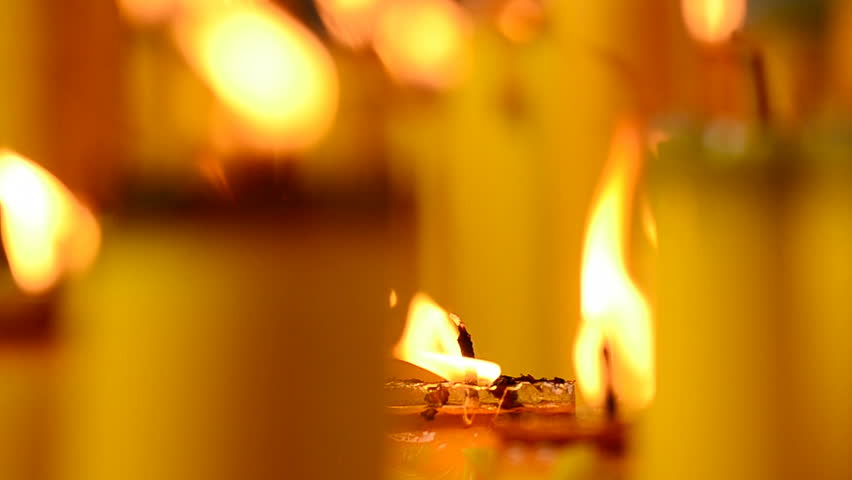 Golden light of candle flame in Chinese Vegetarian Festival