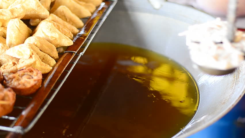Frying tofu with hot oil
