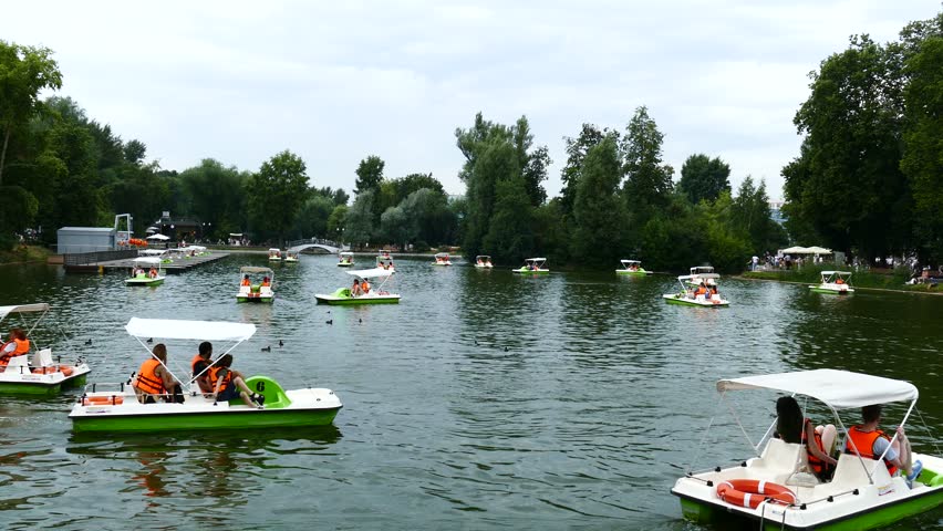 People In Orange Vests Floating On Catamarans On Gorky Park pond