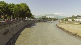 Aerial view of the bridges of Peace. The bridge stretches over the Mtkvari river and connects the areas of old Tbilisi, GEORGIA - Powered by Shutterstock - Get 15% off with code: PIKWIZARD15