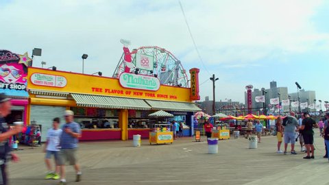 CONEY ISLAND, NY, USA - JULY 1, 2017: Coney Island Nathans hot dogs shot with a gimbal stabilized motion video camera 4k