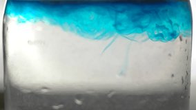 The drops of blue color decomposing in the water. - Powered by Shutterstock - Get 15% off with code: PIKWIZARD15