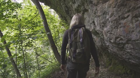 Beauty blonde woman travel in nature mountain with backpack