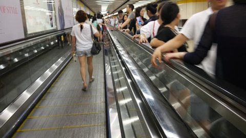 Hong Kong, Hong Kong S.A.R.-June 3, 2017: View of Moving walkway in subway station in Hong Kong. Commuters are inside the subway station. 