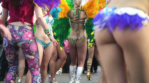 Concept Brazilian carnival. Street Samba dancers in full costume before start of carnival procession
